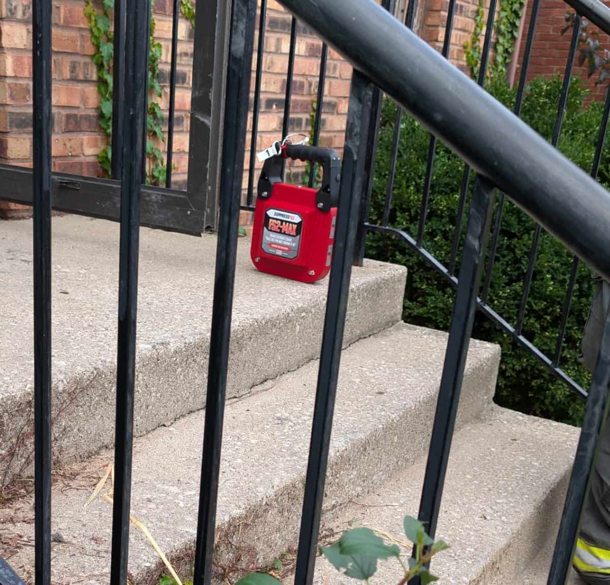FS2-MAX unit on the front stoop, label visible through the railing
